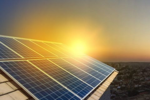 solar-power-panels-on-a-roof-at-sunset